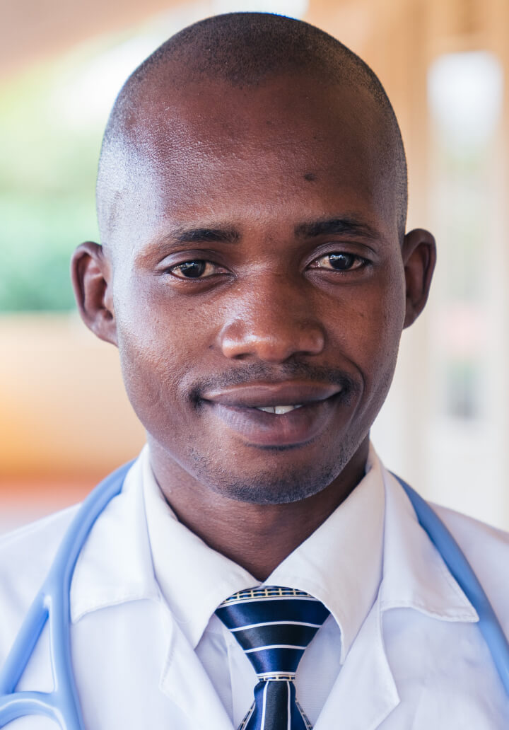 headshot of doctor denis kayumba
